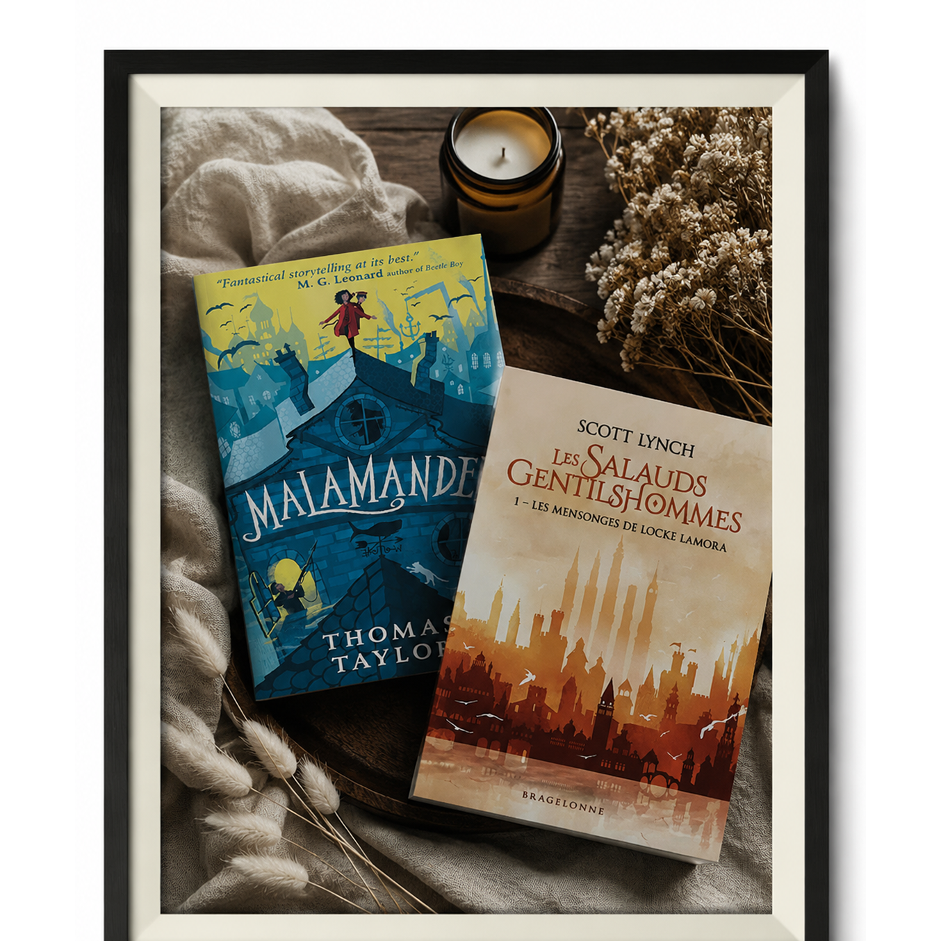 Two published books arranged in a framed author display